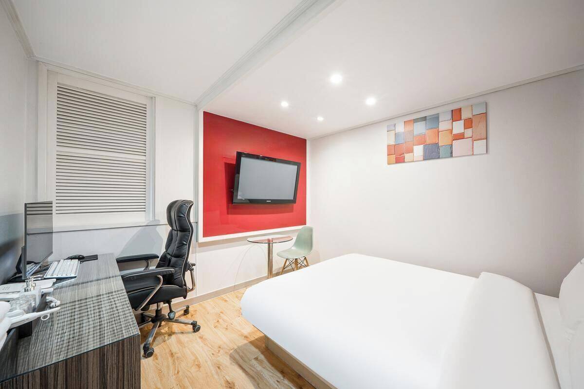 Desk, laptop workspace, blackout curtains, free WiFi