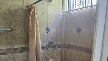 Shower, towels, soap, toilet paper