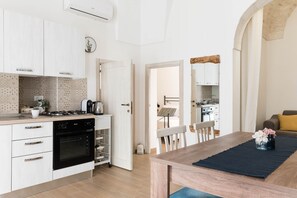 Fridge, oven, coffee/tea maker, cookware/dishes/utensils