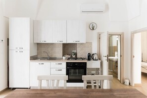 Fridge, oven, coffee/tea maker, cookware/dishes/utensils