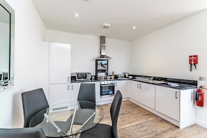 Apartment | Private kitchen | Full-sized fridge, microwave, oven, stovetop