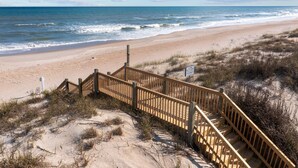A wooden staircase leading to a beach with a view of the ocean. - Summer Winds #191 - Ocean Views, Hot Tub & Steps to the Beach! Dog Friendly! (North Topsail Beach)