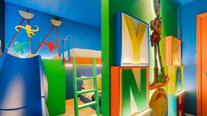 A children's playroom with colorful alphabet blocks, a hanging monkey sculpture, and a green ladder. - 1149 Spacious Family 5-bedroom Townhome (Clermont)