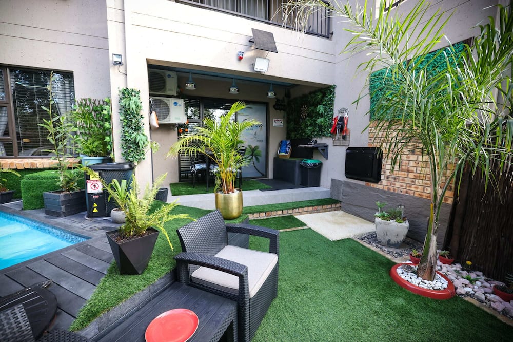 Luxury 2-bedroom Apartment Near OR Tambo With Private Garden & Heated Pool