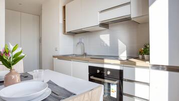 Apartment, 1 Double Bed, Balcony, City View | Private kitchen | Dining tables