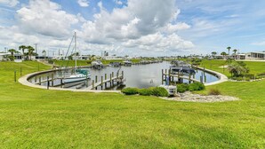 A marina with boats docked, surrounded by grassy areas and palm trees. - 2 Mi to Venice Beach: Home w/ Pool Access (Venice)
