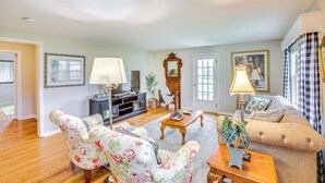 A living room with floral-patterned chairs, a wooden coffee table, a sofa, and a fireplace. - 4 Mi to Dtwn: Goodlettsville Getaway w/ Yard (Goodlettsville)