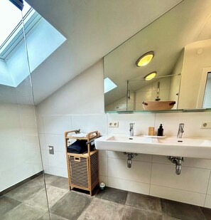 Shower, hair dryer, towels, toilet paper