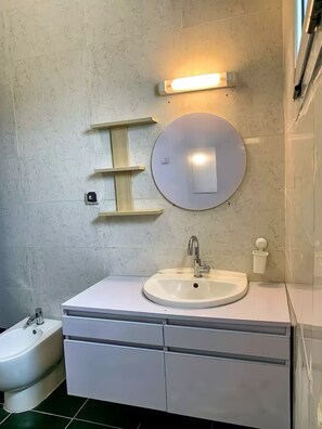 Shower, towels, soap, toilet paper