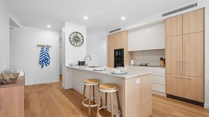 Fridge, stovetop, toaster, cookware/dishes/utensils