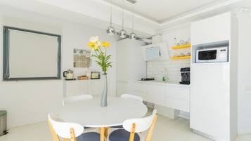 Deluxe Apartment, Balcony, Sea View | Private kitchen | Espresso maker, coffee/tea maker, highchair, paper towels