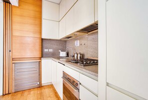 Comfort Apartment, City View | Private kitchen - Charming studio balcony near CityLife (Milan)