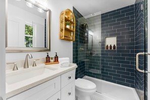 Shower, hair dryer, towels, soap