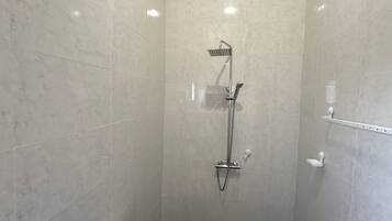 Shower, towels, soap, toilet paper