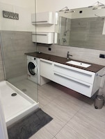 Apartment, Balcony, Lake View | Bathroom | Shower, free toiletries, hair dryer, towels