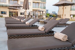 Outdoor pool, pool umbrellas, pool loungers