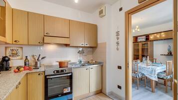 Standard Apartment, 2 Bedrooms, 2 Bathrooms (Garda Lake View From The 7th Floor) | Private kitchen | Fridge, microwave, oven, stovetop