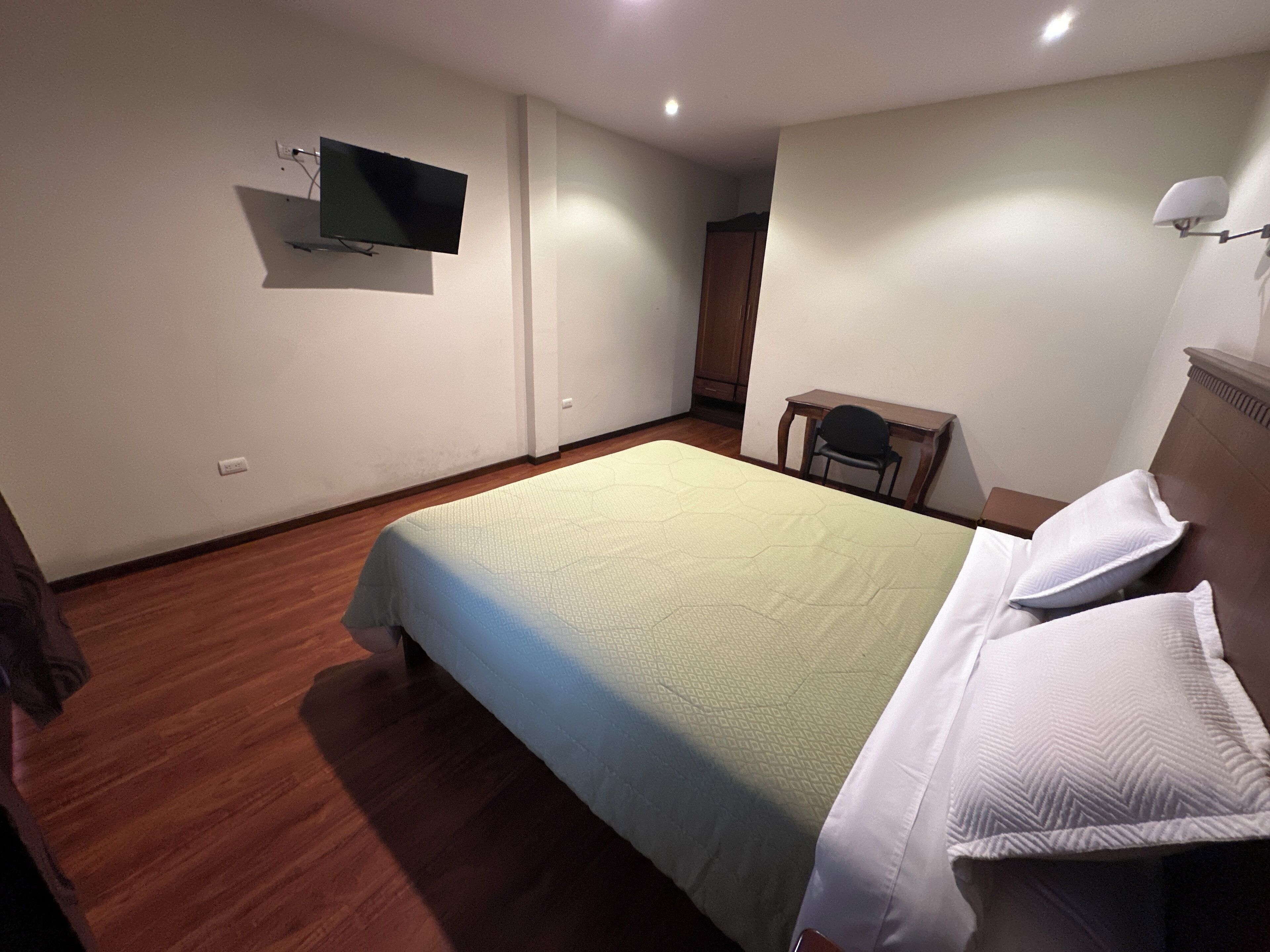 Desk, laptop workspace, free WiFi, bed sheets