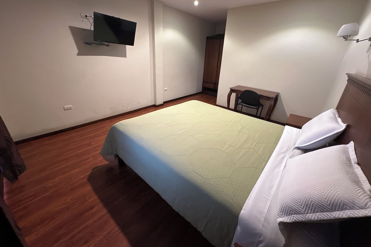 Desk, laptop workspace, free WiFi, bed sheets