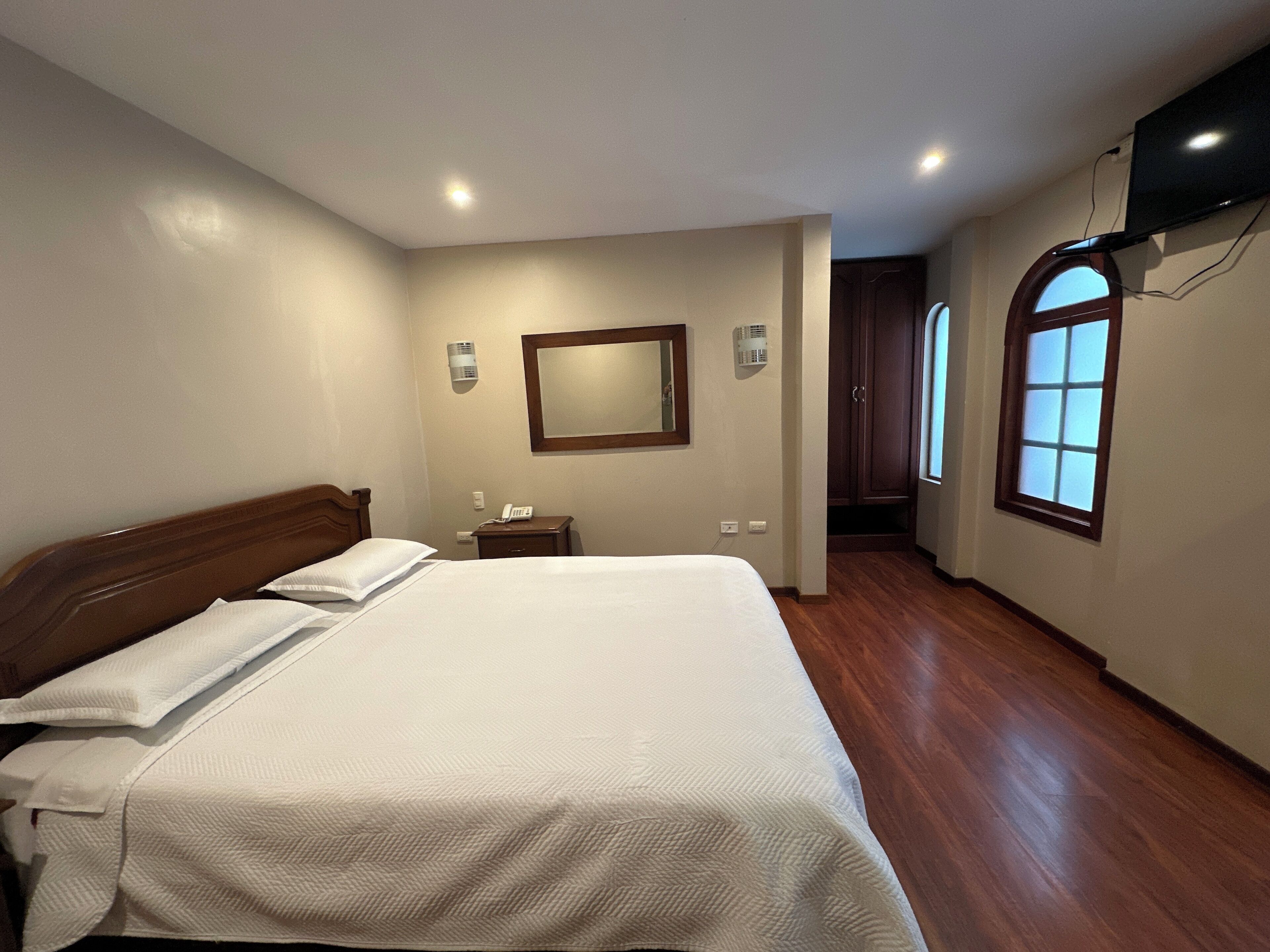 Desk, laptop workspace, free WiFi, bed sheets