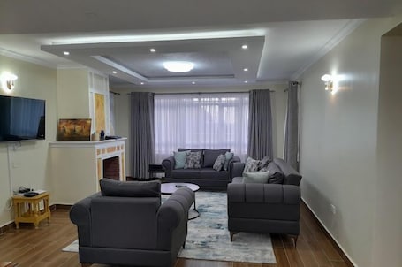 Family Villa, Balcony, Garden View | Living area | 32-inch Smart TV with digital channels