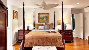 A four-poster bed with a canopy, wooden nightstands, a ceiling fan, and a painting on the wall. - Lx121 Pristine Tahoe Experience (Zephyr Cove)