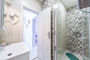 Hair dryer, towels, soap, toilet paper
