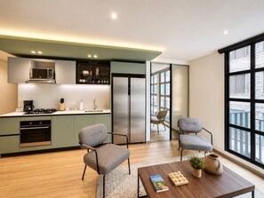 Executive Apartment, Terrace | Private kitchen | Microwave, oven, dishwasher, coffee/tea maker -  Casa Indigo Apartahotel Parque 93 (Bogotá)