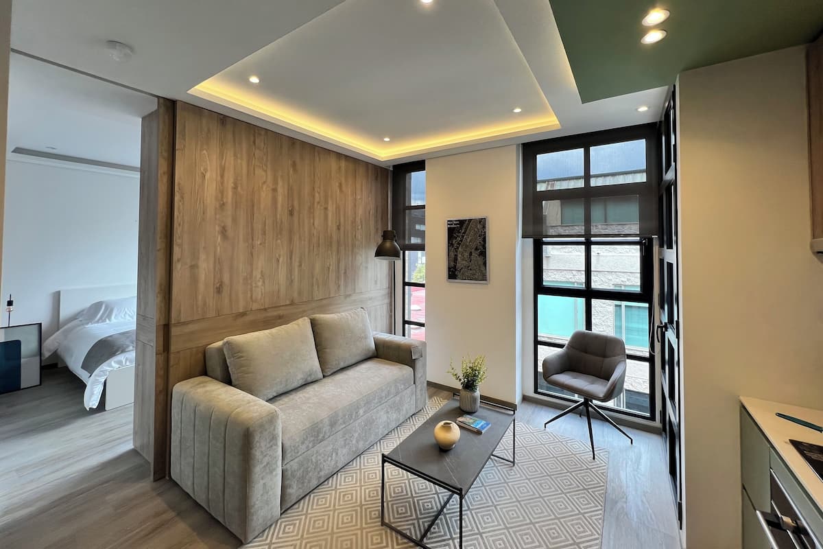 Standard Apartment, Balcony | Living area | 32-inch LED TV with digital channels, Netflix, streaming services