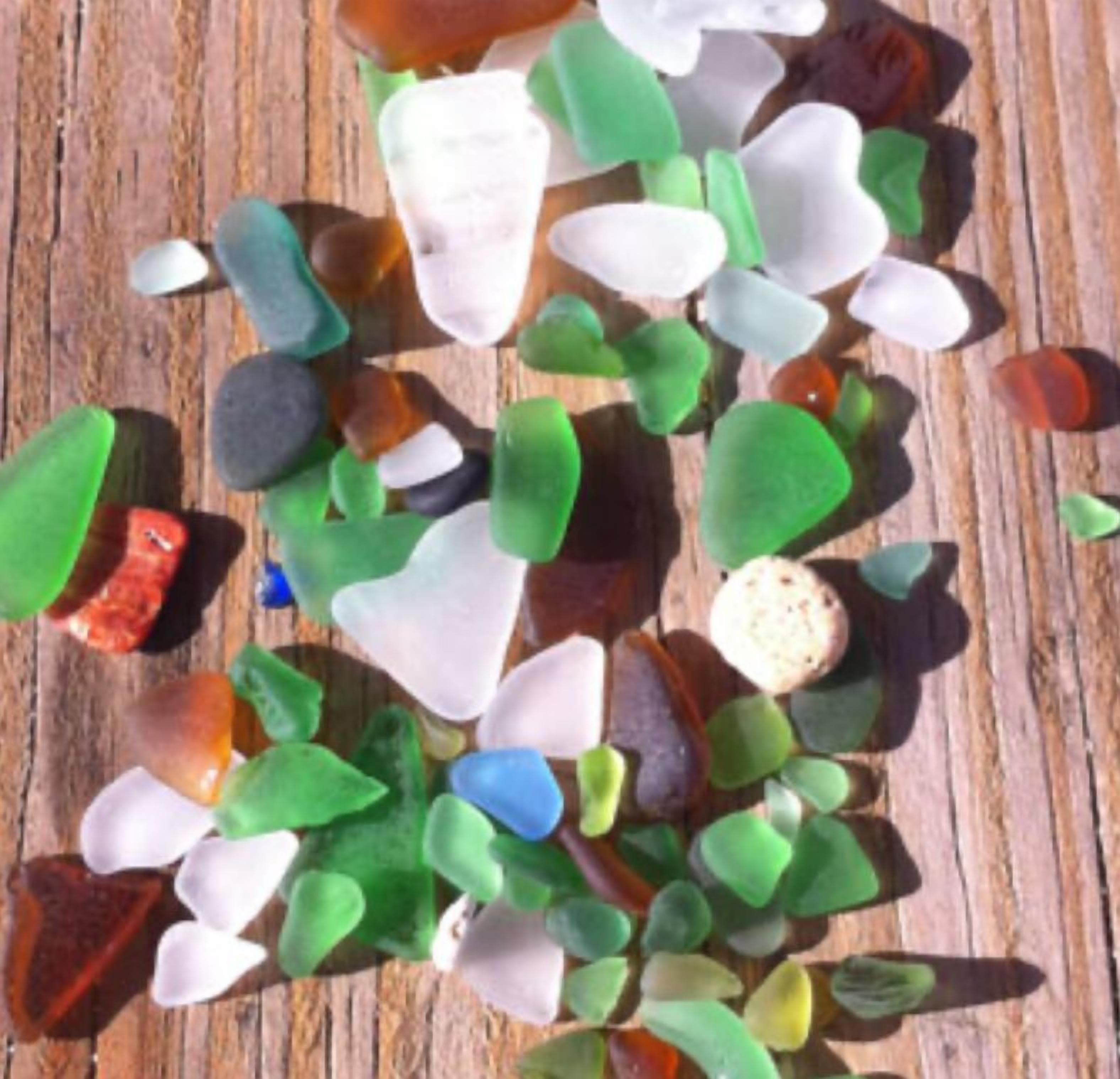 A collection of glass pieces on a wooden surface.