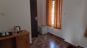 Deluxe Double Room, City View | Living area | TV - NIRUPAMA HOTEL ALUVA (Aluva)