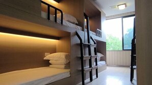 A bunk bed room with a wooden headboard, a staircase, and a large window. - Rlan Boutique Hotel (Shanghai)