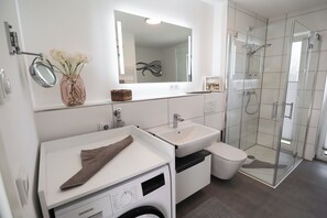 Shower, hair dryer, towels