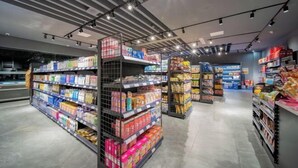 A modern supermarket interior with neatly organized shelves and a clean, well-lit environment. - Kunlun Hotel (Nantong)