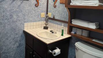 Shower, towels, soap, toilet paper