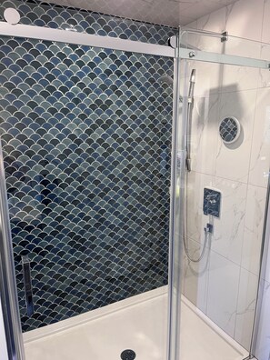 Shower, hair dryer, towels, soap