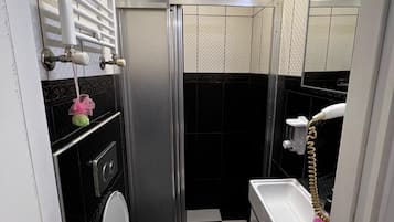 Economy Suite, City View | Bathroom | Shower, rainfall showerhead, free toiletries, hair dryer