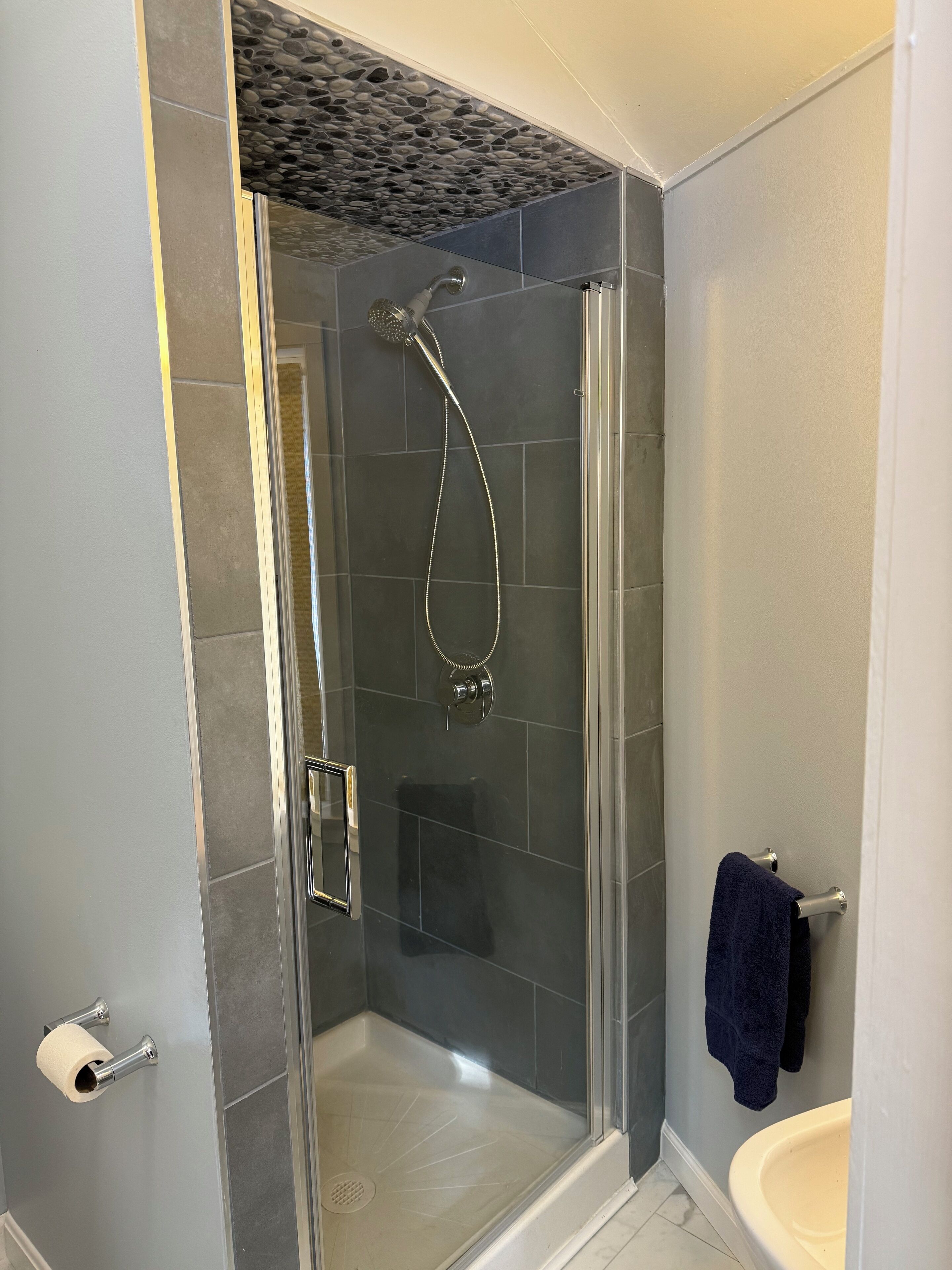Shower, hair dryer, towels, soap