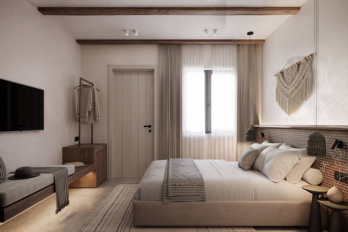 Une chambre à coucher avec un grand lit, une table de chevet, une télévision et une armoire.