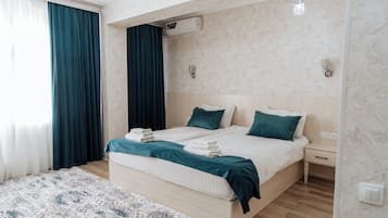 Deluxe Double or Twin Room, Courtyard View | Desk, laptop workspace, soundproofing, iron/ironing board