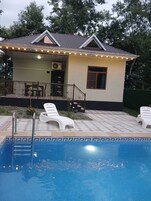 Habitación cuádruple Confort, vistas al jardín | Piscina privada