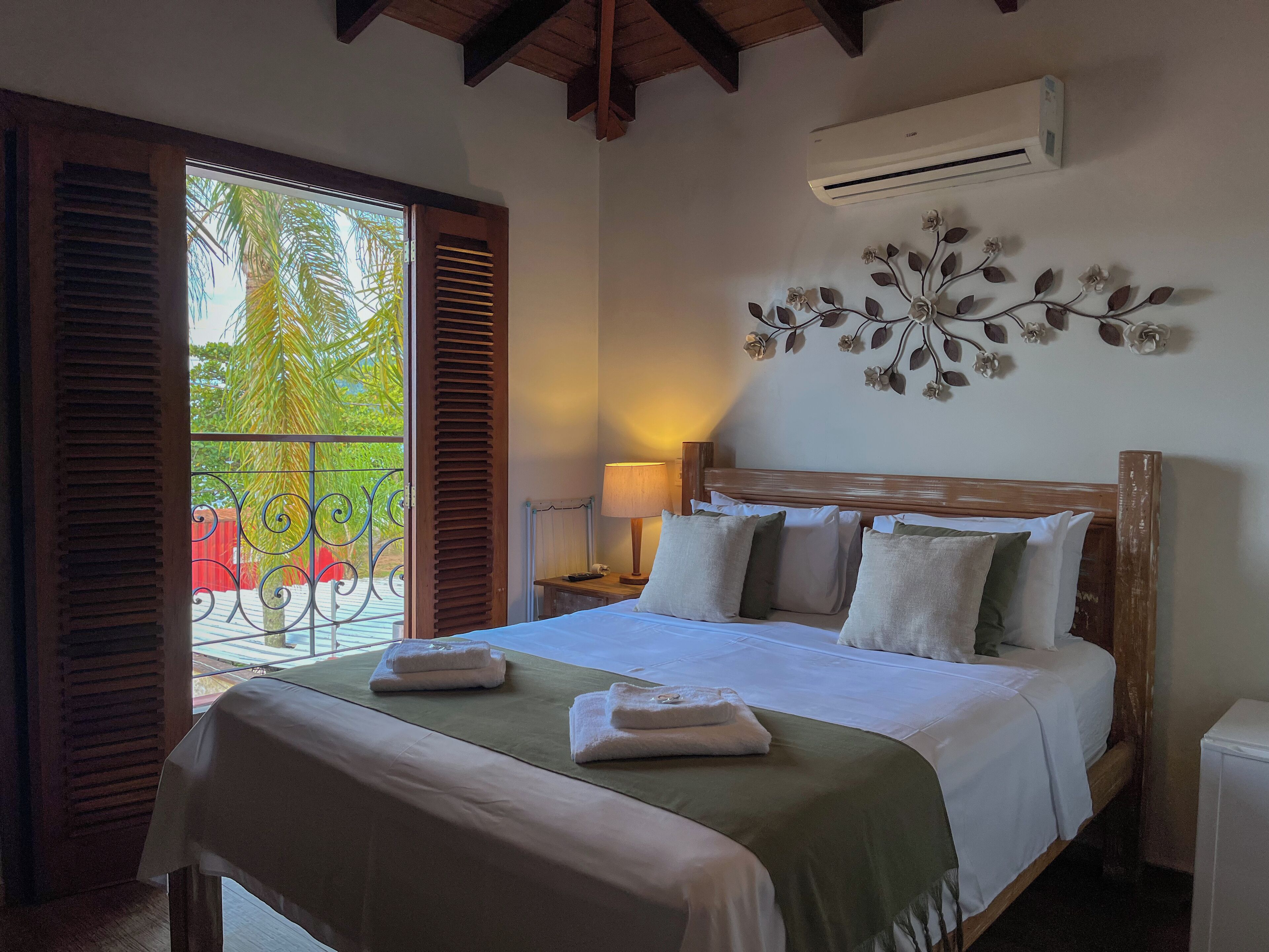 Deluxe Double Room, Lanai, Beach View | Minibar, desk, laptop workspace, iron/ironing board