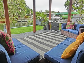 Terrace/patio - Family-Friendly Riverfront Home w/ Game Room, Kayaks, Swim Mat & Space to Play (Weeki Wachee)