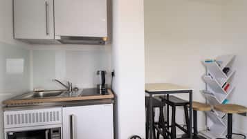 Fridge, microwave, cookware/dishes/utensils