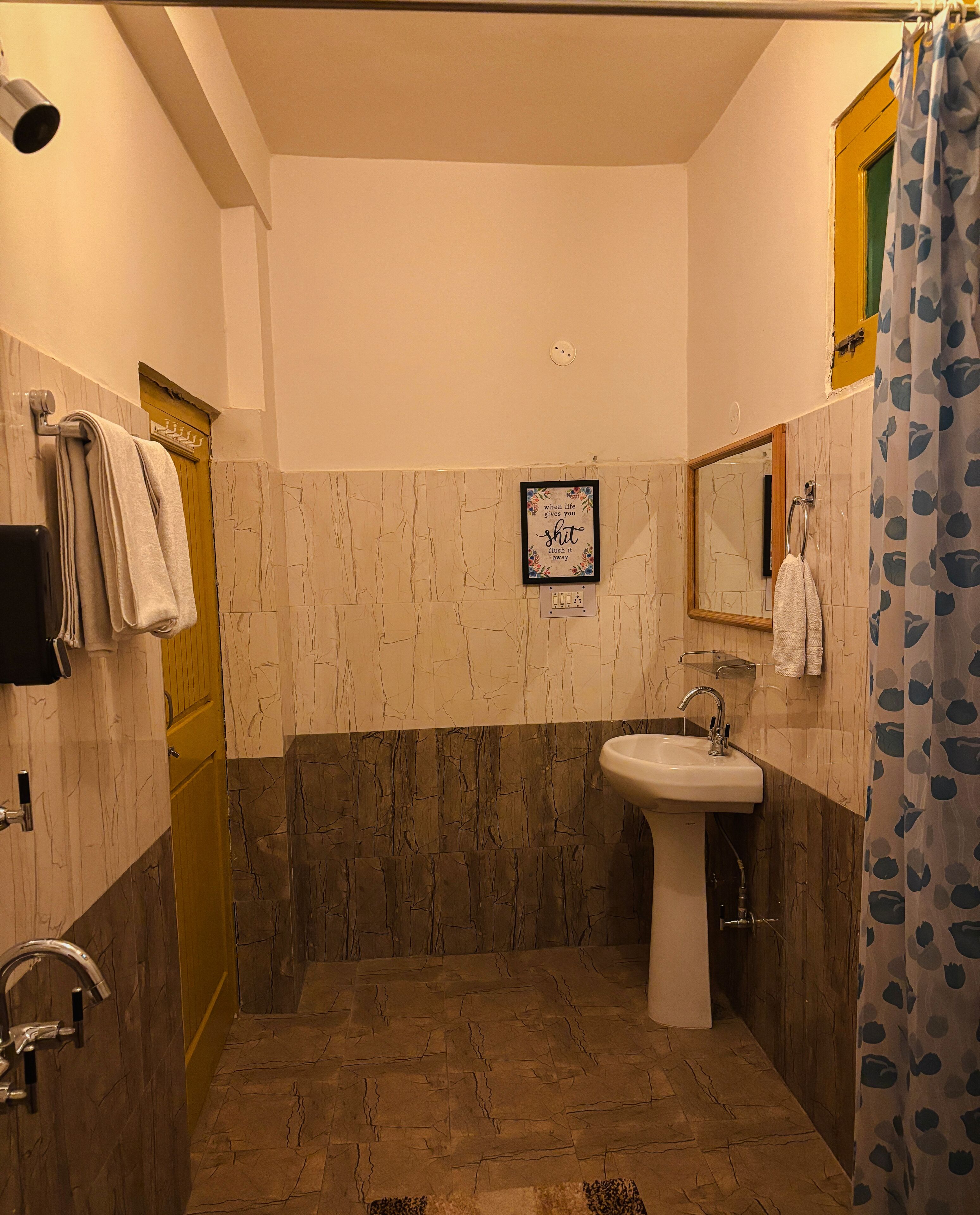 Shower, towels, soap, toilet paper