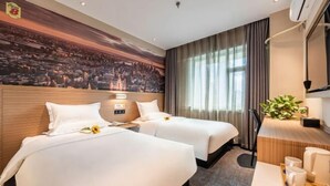 A hotel room with two beds, a desk with a chair, a large window with curtains, and a wall mural. - Super 8 Collection Hotel (Lanzhou Railway Station Hongxingxiang Subway Station) (Lanzhou)