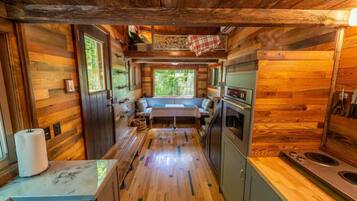 Fridge, microwave, coffee/tea maker, cookware/dishes/utensils