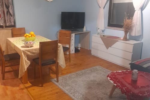 House (Holiday Home Village Paradise) | Living room | 32-inch flat-screen TV with cable channels