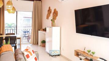 Suite Elite | Área de sala de estar | Televisión de pantalla plana