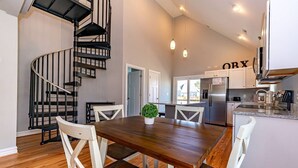 A modern kitchen with a built-in oven, a refrigerator, and a coffee maker. - OBX Golf & Family Fun Cottage (Powells Point)